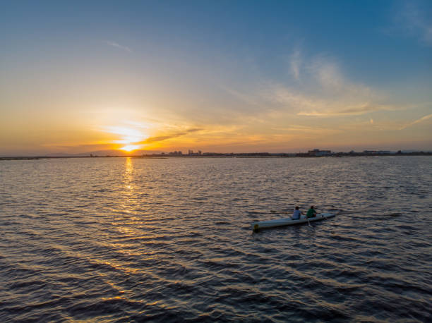 istock Two male rowers sculling on river stock photo 1680741079