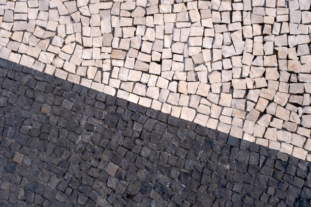 istock Portuguese traditional black and white pavement made from calcada tiling. 1680761518