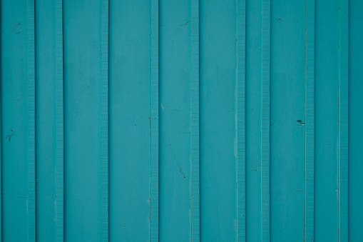 blue green wooden background with old painted boards