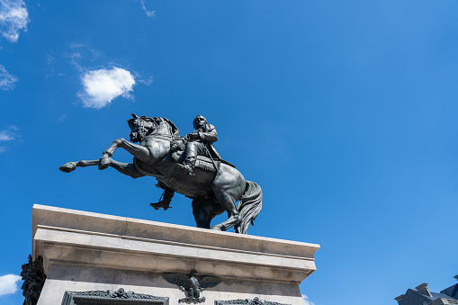 Puerta del Sol in Madrid, January 23, 2020. Classic and loved by the locals, the sign of the Gonzalez Byass company in its new location, and its Jerez Tio Pepe wines. Equestrian statue of Carlos III.