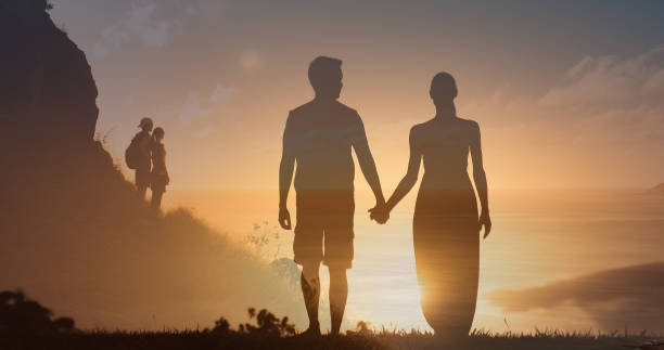istock Couple holding hands and watching beautiful sunset. 1680778589