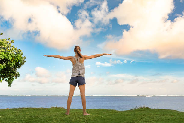 Woman exercising in the beach park.