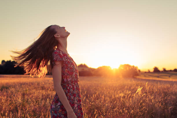 istock Woman feeling energized at sunset outdoors. 1680786713