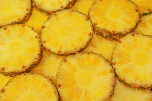 istock Pineapple juicy yellow slices as a background. 1680788928