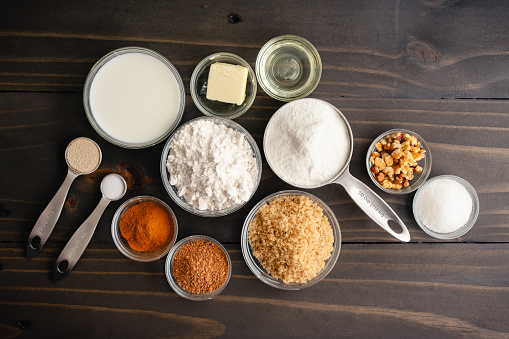Overhead view of flour, brown sugar, nuts, and other street food ingredients