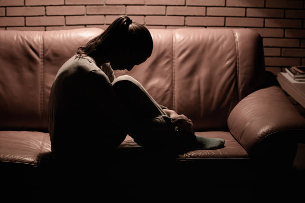 istock Sad woman sitting on the sofa. 1680796339