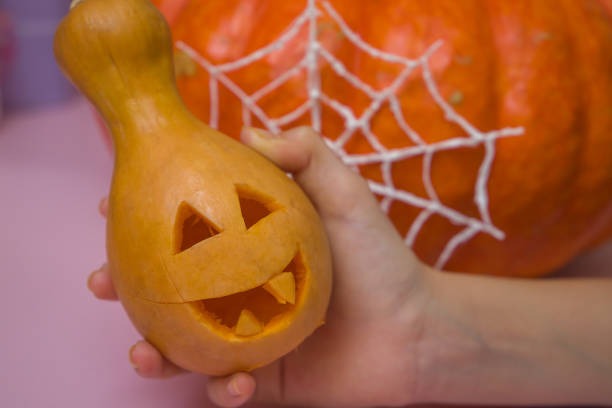 istock halloween jack - o - lantern in hand 1680813634