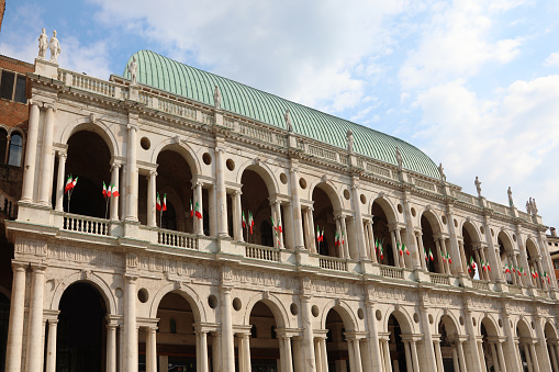 Vicenza, VI, Italy - June 1, 2020: Ancient Monument called BASILICA PALLADIAN with italian flags