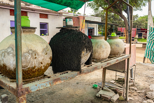 big clay jars are placed on road sides for storage of drinking water for traveler at day