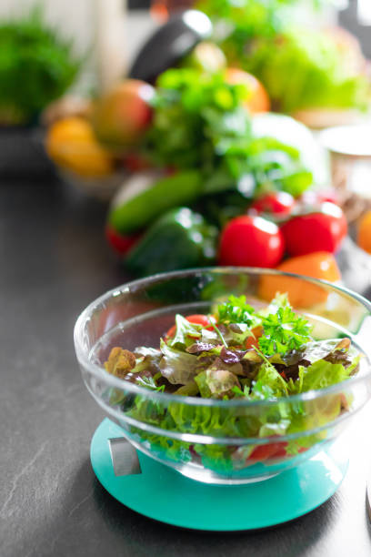 istock A closeup of a fresh healthy salad on a kitchen scale 1680855151