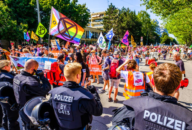 police officer at a demonstration in munich Munich, Germany - September 10: police officers at a demonstration against the IAA (international automobile exhibition) in Munich on September 10, 2021 extinction rebellion stock pictures, royalty-free photos & images