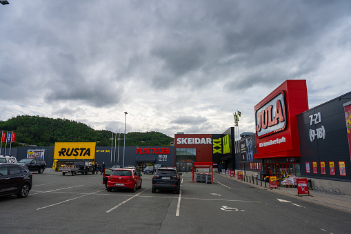 Lyngdal, Norway - June 27 2023: Parking lot at Handelsparken in Lyngdal.