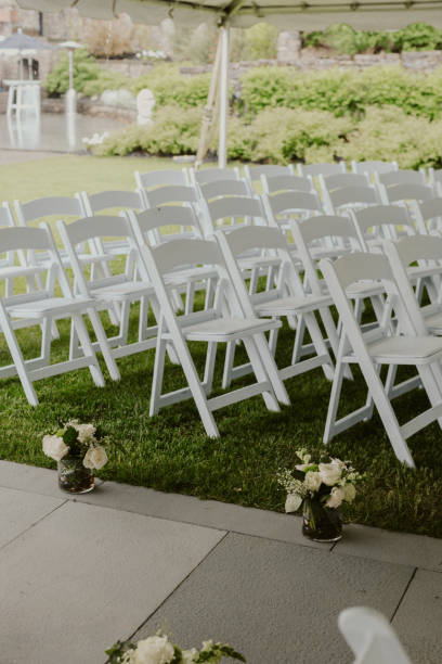 istock White Chairs aligned for wedding guests to sit for ceremony 1680873654