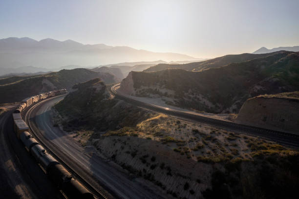 istock Overlooking a train rounding a bend in the track at sunset 1680874766