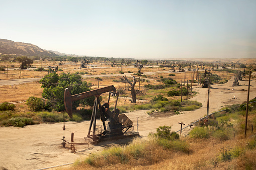 Field of oil rigs visible from passenger train in Salinas, California, United States
