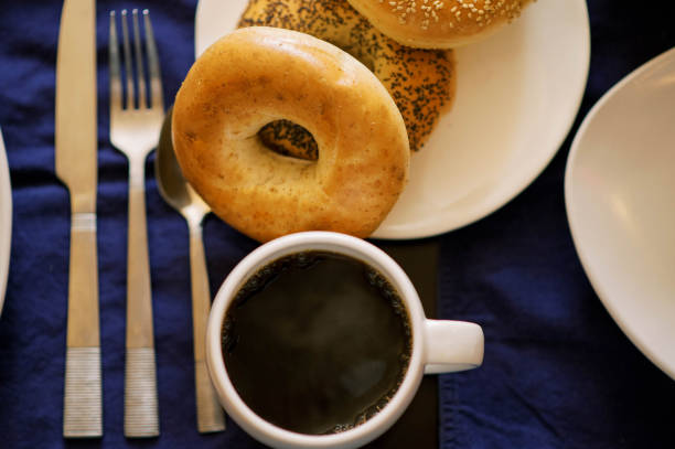 Inviting plate of fresh bagels and black coffee in New York, New York, United States