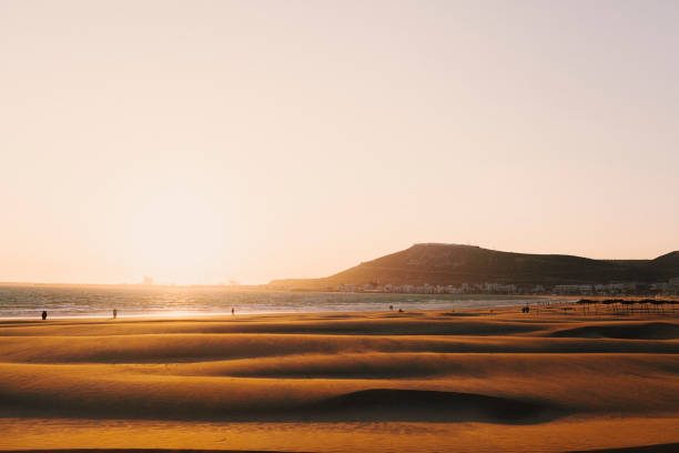 The sunset on a sandy beach in Agadir, Morocco. The sunset on a sandy beach in Agadir, Morocco. in Agadir, Souss-Massa, Morocco sunset agadir marocco stock pictures, royalty-free photos & images