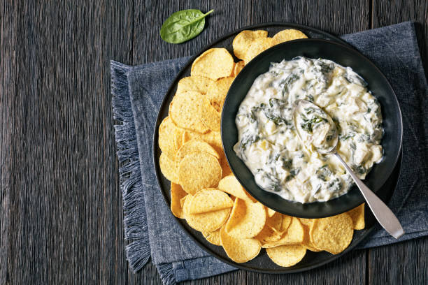 istock artichoke spinach almond dip with potato chips 1680891311