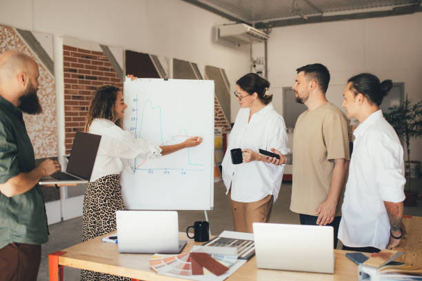 istock Group of young people designers having meeting in a modern office. 1680926896