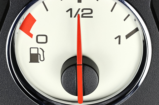 fuel gauge in car dashboard - half full