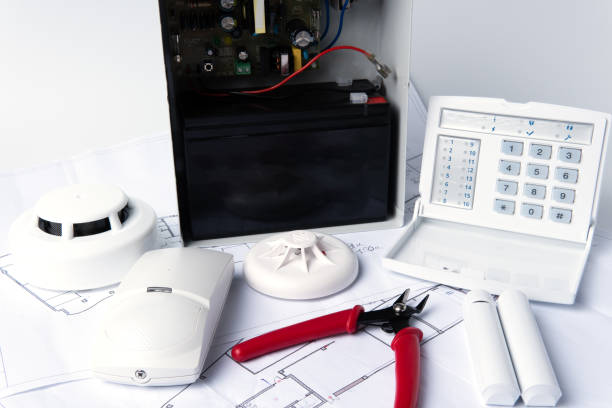 istock Fire safety system construction. Smoke detector on blueprint drawing background. Fire protection, emergency evacuation plan 1680977138