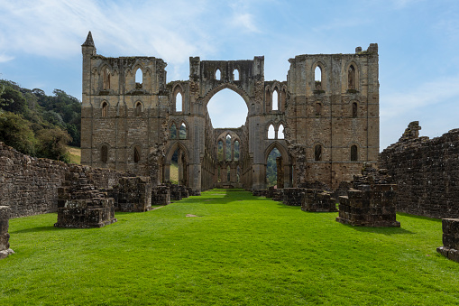 rievaulx abbey north yorkshire from the west showing the remains of the tower and south transept sunny day no people
