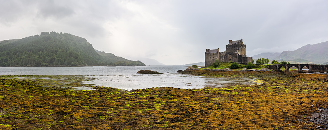 Scotland, UK, August 20, 2023: Early morning sunlight over Eilean Donan Castle at Kyle of Lochalsh in the Western Highlands of Scotland.