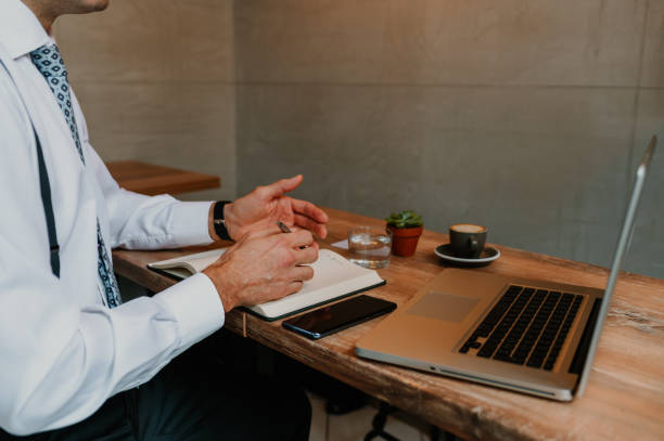 istock Businessman having an online meeting at the coffee shop while using technology 1681027848
