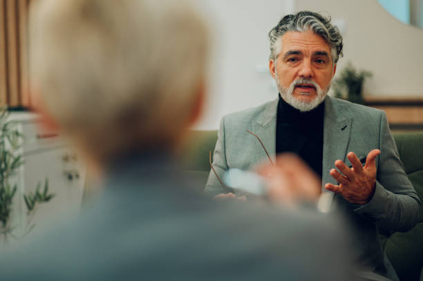istock A senior man is discussing problems in a session with a psychotherapist. 1681033703