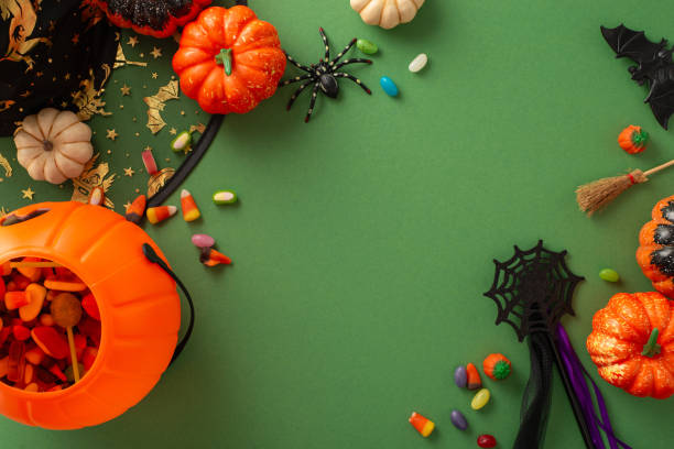 istock Immerse yourself in Halloween spirit with this top view snapshot featuring witch attributes, Halloween-themed decor on a green isolated background, complemented by copy-space for text or adverts 1681040104