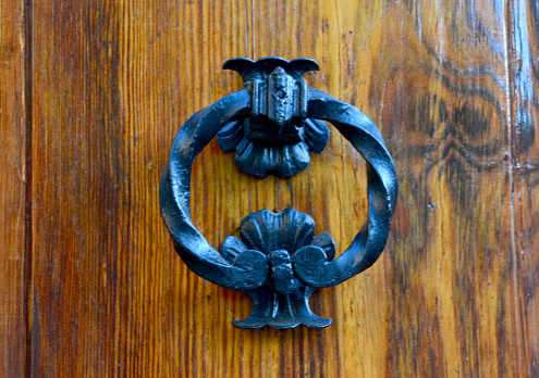 Vintage door knob on old wooden door.