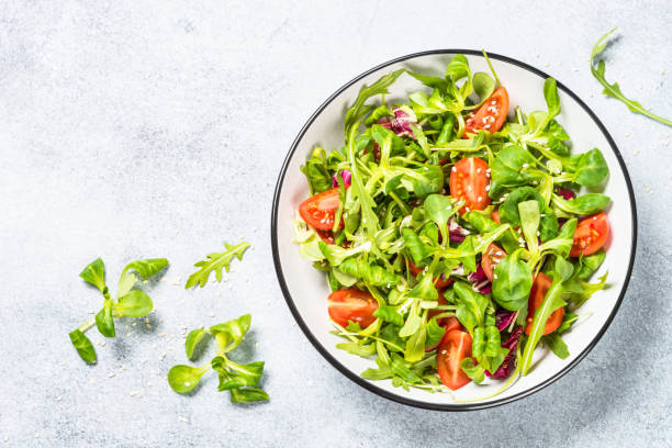 istock Green salad with arugula, lamb and tomatoes. 1681082128