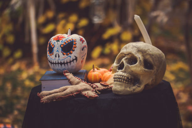 istock Scary human skull, Voodoo doll and pumpkin Halloween. 1681088484