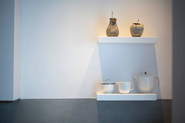 istock Some white pots and crockery on white shelfs in a modern interior kitchen fancy decor white wall 1681091788
