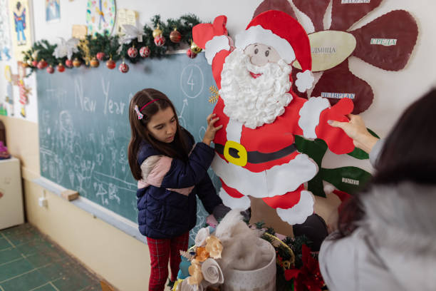 istock New Year school event. Decorating a classroom. 1681100284