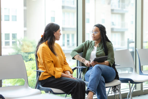 istock Mental health professional listens as client shares something during session 1681105161