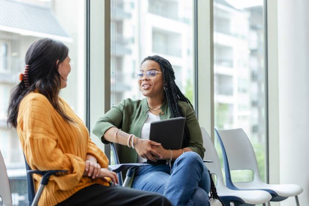 istock Encouraging therapist talks to patient 1681105739