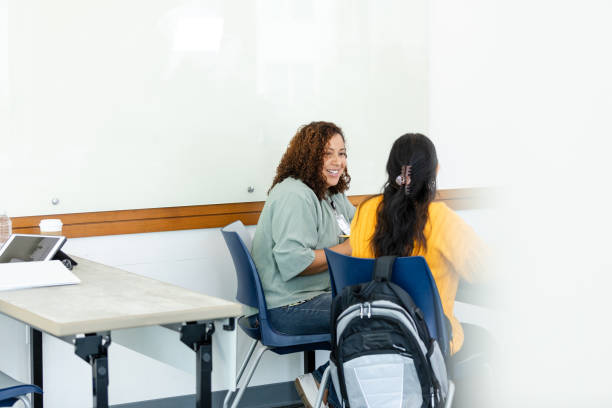 istock Rear view female tutor helping unrecognizable female student 1681107529