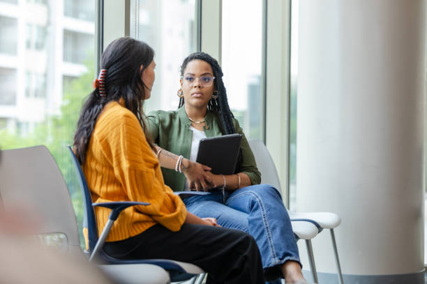 istock With non-judgmental look, female counselor listens to female client 1681107915