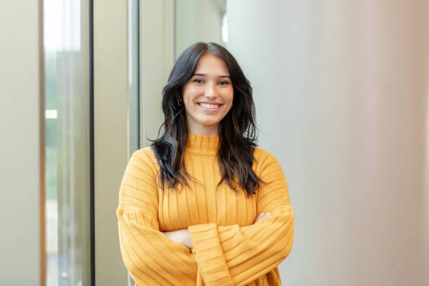 Portrait of beautiful, confident young adult female university student stock photo