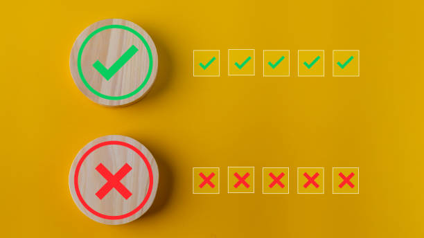 istock Right and wrong or voting yes or no concept. Wooden blocks with check marks on a yellow background. The idea of choice. 1681112146
