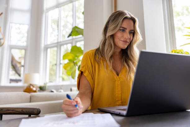 istock Woman working at home on her laptop computer 1681119193