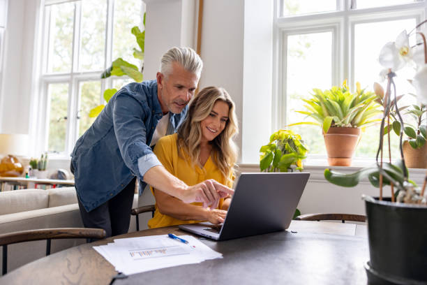 istock Mature couple looking at their home finances 1681119761