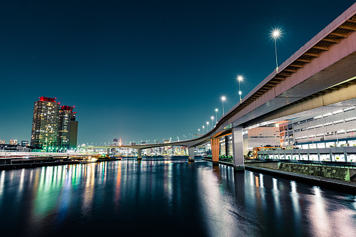 Tokyo Bay Rainbow Bridge highway harbour loops illuminated at night Japan