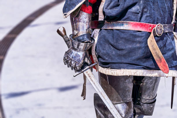 istock medieval knight warrior gripping a large sword in close-up 1681139298