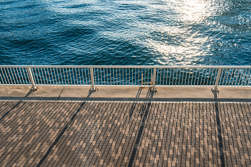 istock Metal railing made on a concrete pier by the sea 1681149909