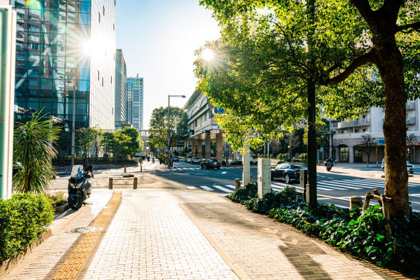 Modern buildings in downtown of Tokyo on view from empty footpath