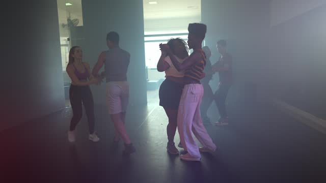 Young couples dancing at a dance studio