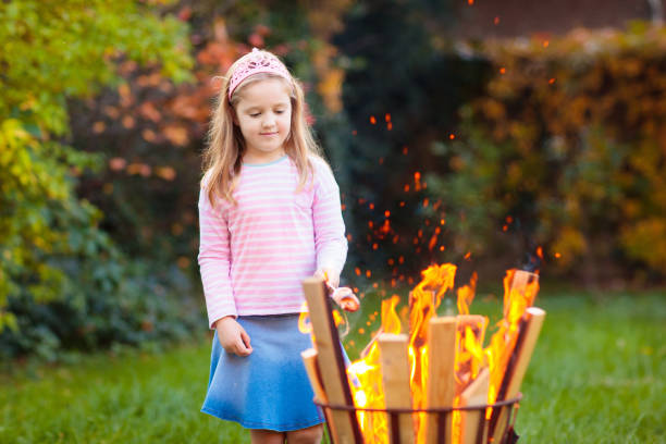 istock Child with smores at fire. Kids roast marshmallow. 1681170427