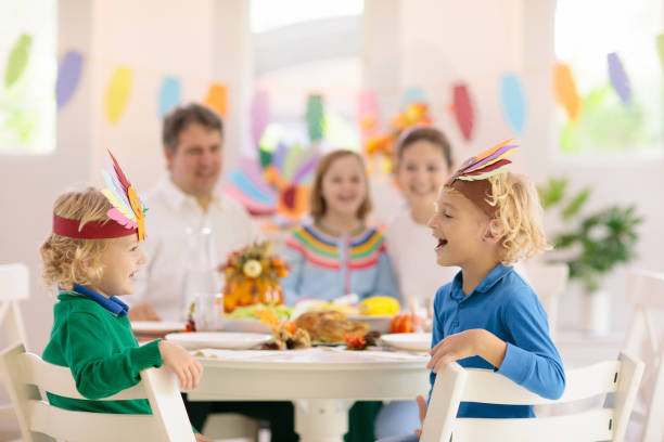 istock Family with kids at Thanksgiving dinner. Turkey. 1681190832